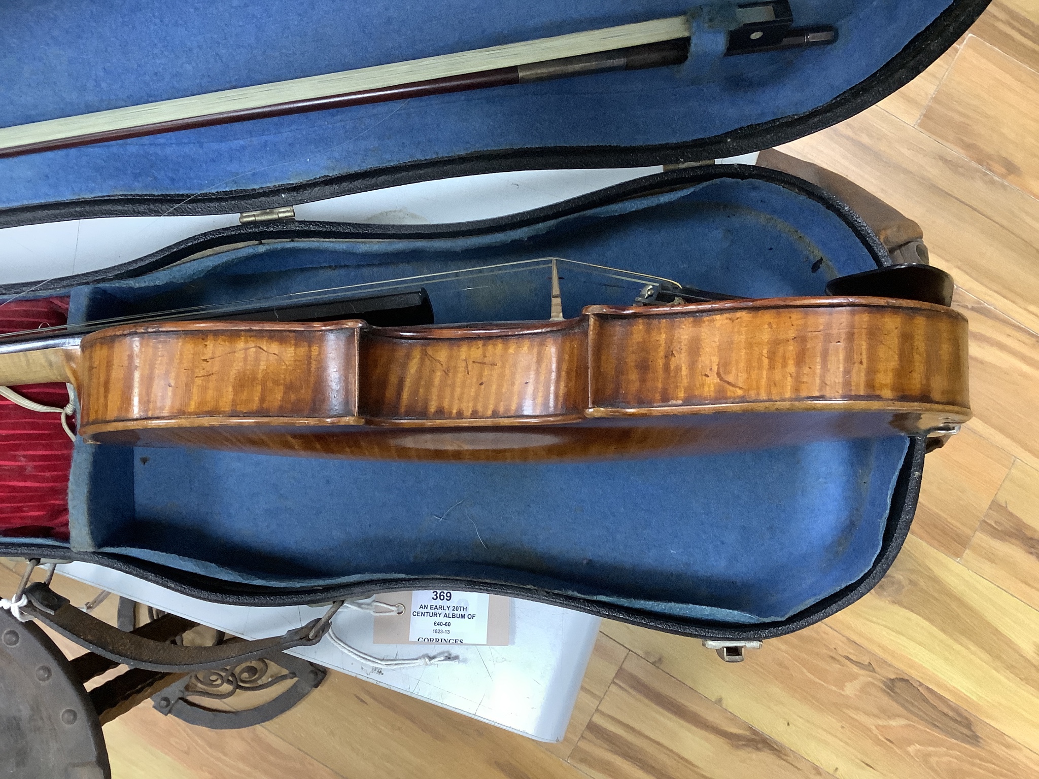 A cased violin and bow